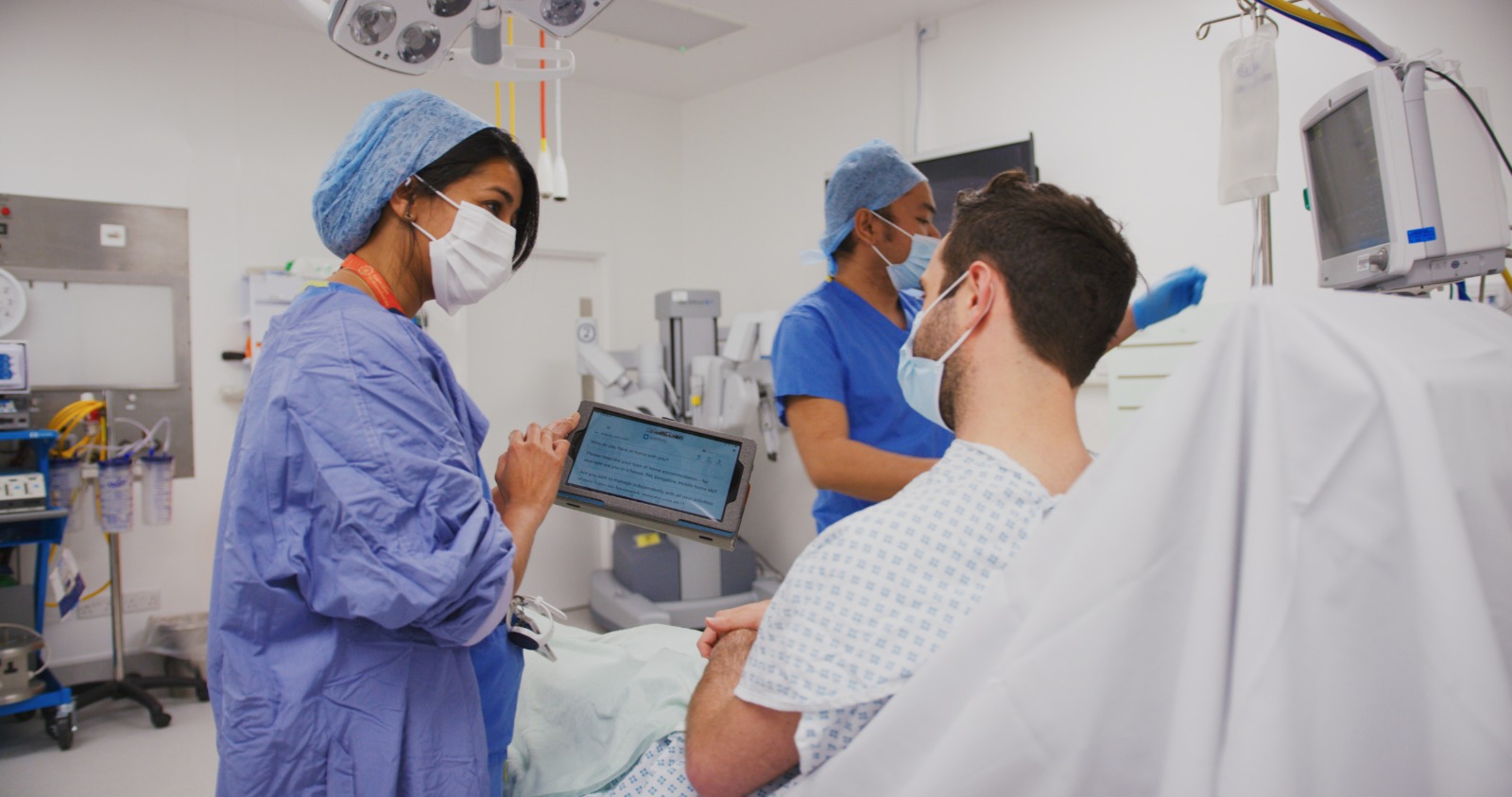Medical staff talk to their patient using CardMedic in a theatre setting.