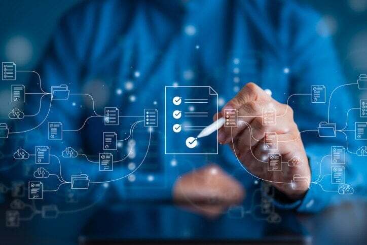 A graphic representation of a person interacting with workflows with a stylus