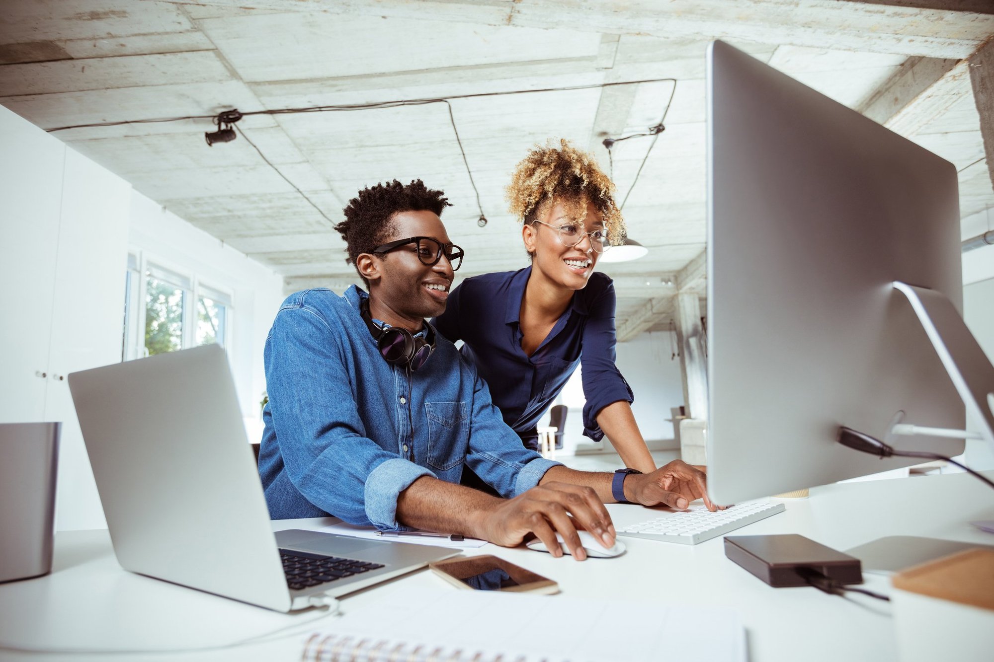 man and woman reviewing online material