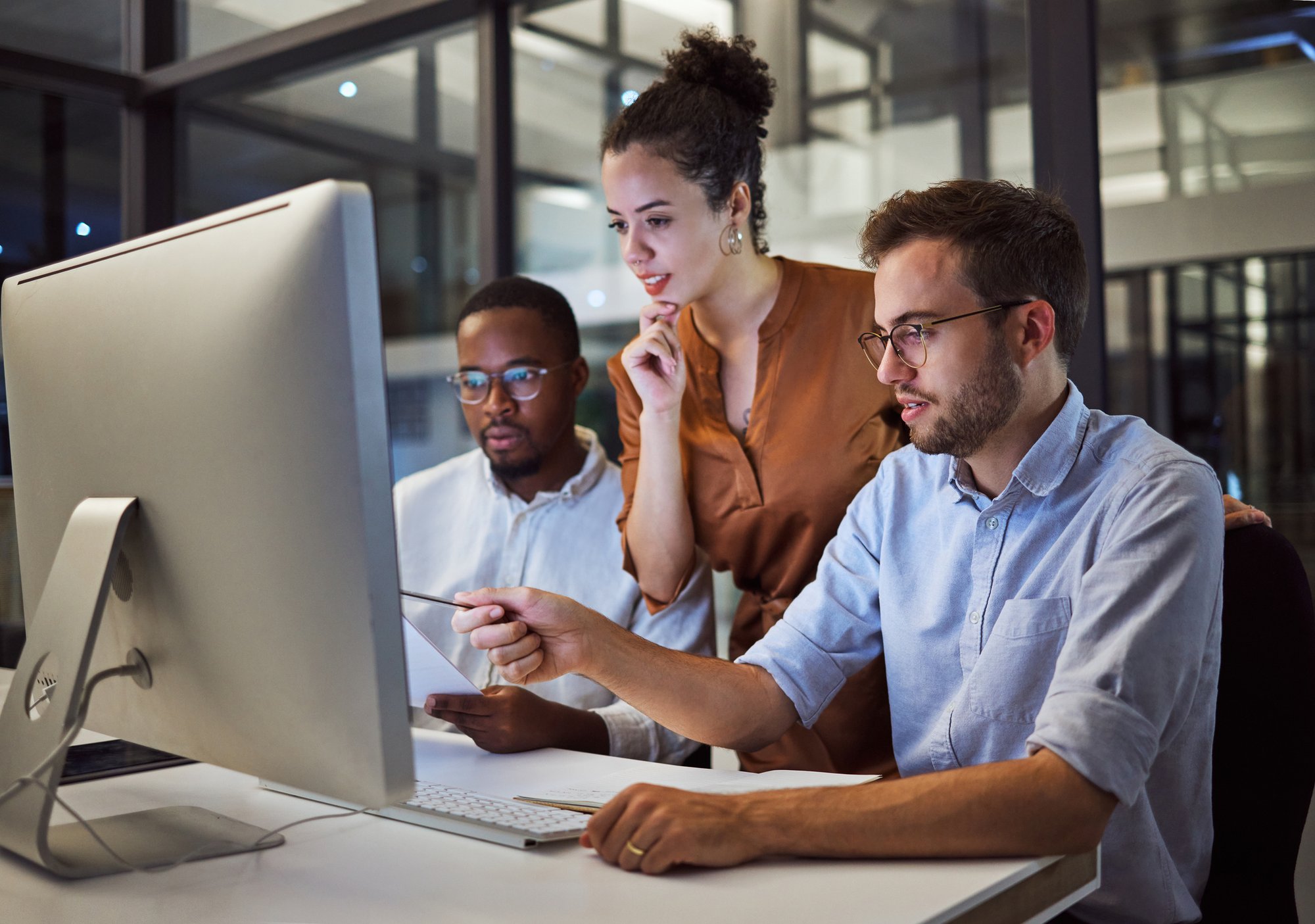 A work team reviews some multilingual content together.