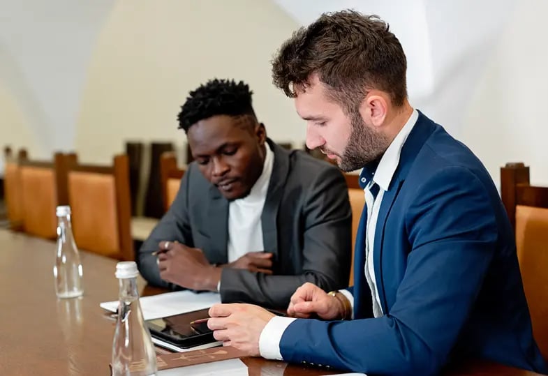 A lawyer goes over translated documentation with a client.