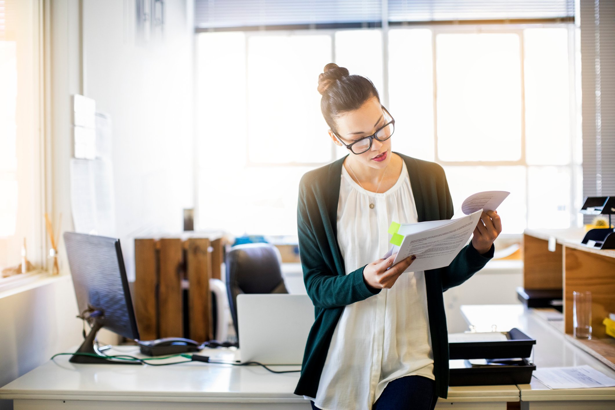 A legal client reviews a document before she sends it in for translation.