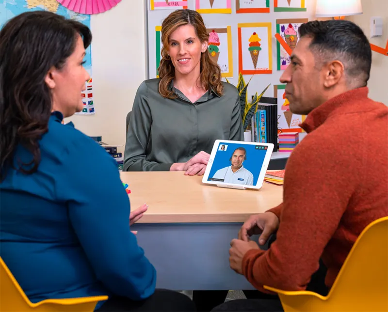 couple-talking-to-teacher